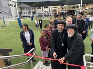 Cutting the ribbon with His Grace Bishop Daniel.