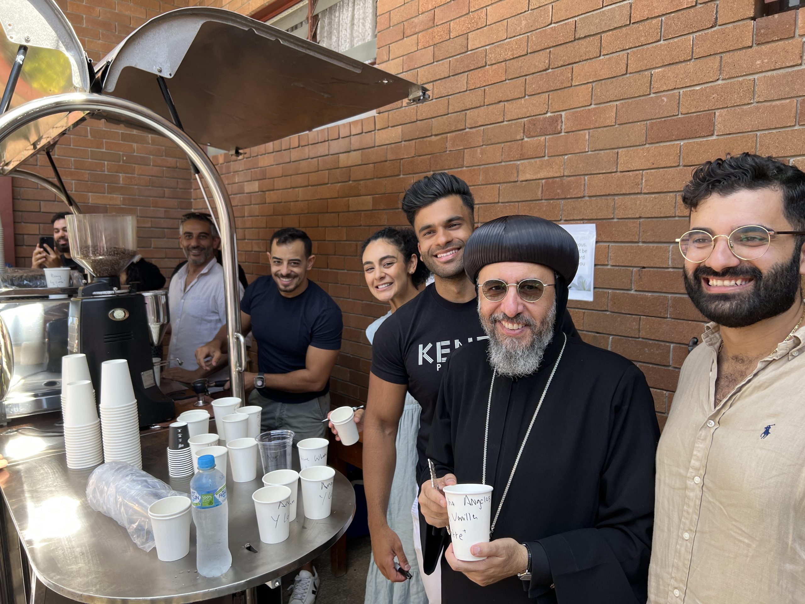 With some youth buying a coffee at the canteen.